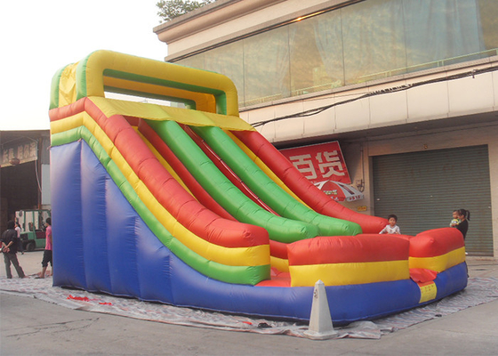 China Diapositiva inflable comercial del carril doble gigante del arco iris para los niños y los niños proveedor